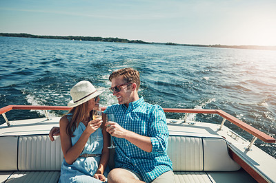 Buy stock photo Cheers, happy and couple with champagne on boat for travel, holiday or weekend trip for valentines day. Smile, toast and man with woman for drinking alcohol on yacht for date together on vacation.
