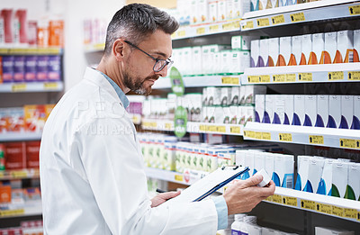 Buy stock photo Pharmacist, man or clipboard with pills inspection for inventory control, label info or expiry date. Pharmacy, mature person or stock count with checklist at shelf for quality assurance and integrity