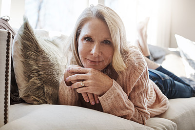 Buy stock photo Cozy, portrait and smile of woman on sofa in living room of home for me time chilling or pause. Break, happy and relax with mature person lying on couch in apartment for morning reset or wellness