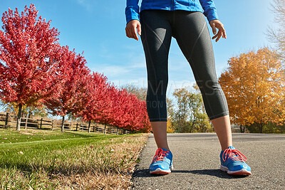 Buy stock photo Fitness, runner and legs of woman in park for exercise, training and workout for wellness. Sports, outdoor and person on road for endurance, challenge and practice for active hobby, health and cardio