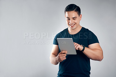 Buy stock photo Design, space and tablet with man in studio for online planning, research or web development. App, digital and scrolling with developer person isolated on gray background for website engineering