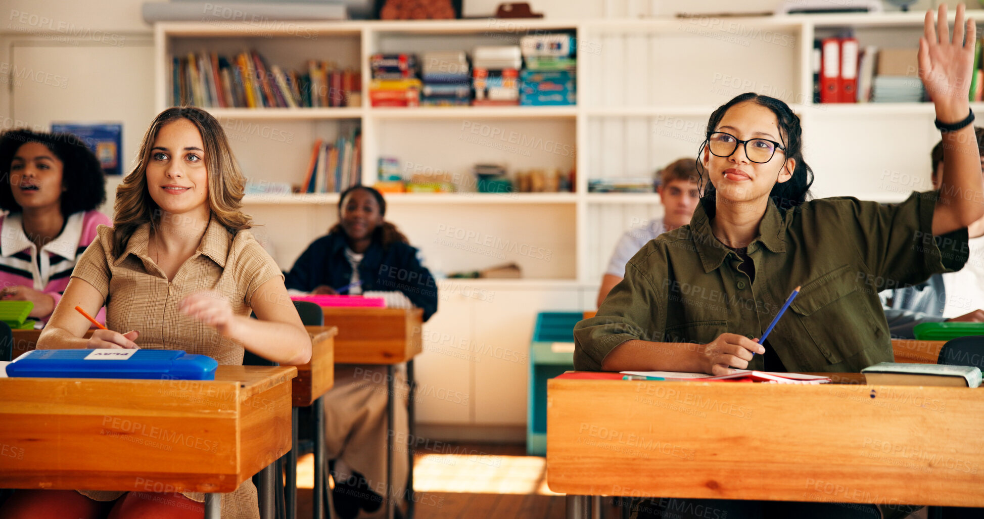 Buy stock photo Question, lesson and students in classroom at high school with learning, education or participation in class. Teen, group and girl with hand raised for knowledge, academic development and interaction