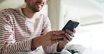 Hands, phone and man on sofa in home with social media, contact or scrolling for networking. Notification, tech and male person with cellphone for connectivity, online or mobile app in living room