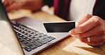 Hands, laptop and credit card for online shopping in home, easy payment and digital banking for bills. Person, computer and online transaction with ecommerce, fintech and retail discount at apartment