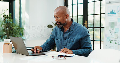 Buy stock photo Finance, business and black man on laptop with notebook for financial analysis, statistics or budget review. Startup, planning and person on computer with graph, documents and research for kpi report