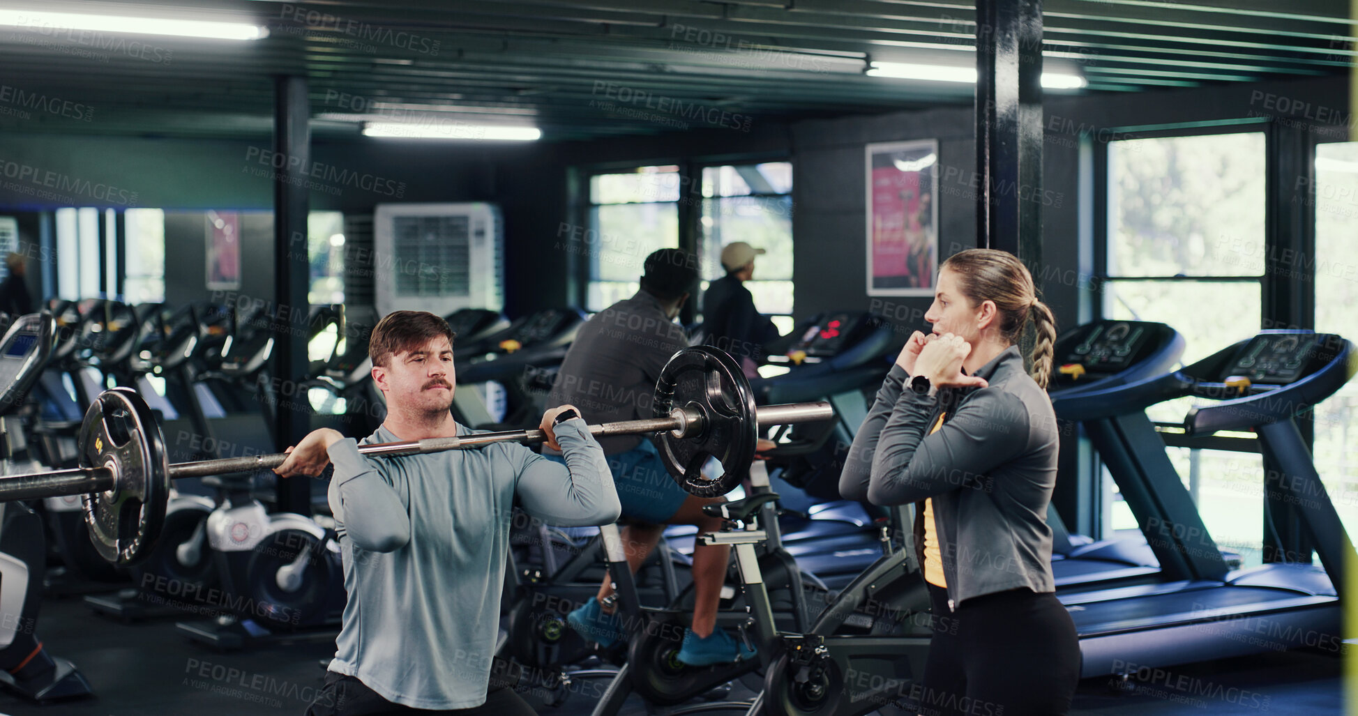 Buy stock photo Fitness, personal trainer or man with barbell in gym, strength challenge or coaching for body goals. Strong, instructor or people with weightlifting exercise for muscle gain, explain form or active