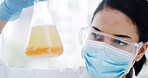 Woman, beaker and scientist at lab with liquid, sample or reaction medical research for virus cure. Person, mask and goggles for science with insight, pharmaceutical study or vaccine development