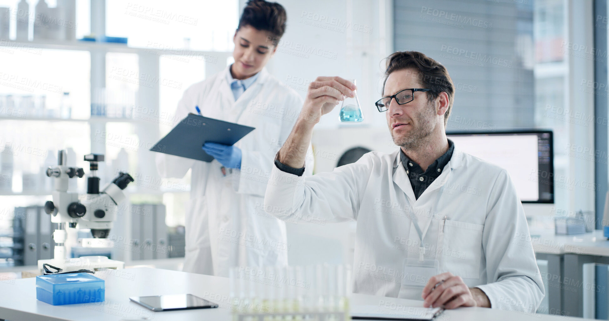 Buy stock photo Man, scientist and team with beaker at lab with clipboard, documents or medical research for virus cure. People, science and woman with review, checklist and pharma study for vaccine development
