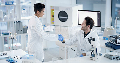 Buy stock photo People, team and shaking hands for science at lab with clipboard, smile or medical research for virus cure. Man, woman and goal with breakthrough, achievement and handshake for vaccine development