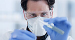 Man, scientist and gloves with test tube at lab with goggles, sample and medical research for virus cure. Person, container and ppe glasses with liquid, exam or pharma study for vaccine development