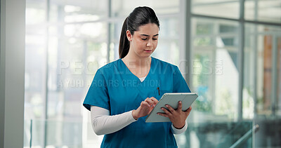 Buy stock photo Woman, doctor and typing with tablet in lobby, review and insight with report at clinic. Person, medical professional and  surgeon with tech, app or feedback for telehealth consultation at hospital