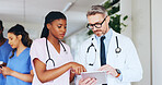 Hospital, meeting and doctor on tablet with nurse for online report, patient results and treatment plan. Healthcare, team and man and woman on tech for medical research, surgery schedule and advice