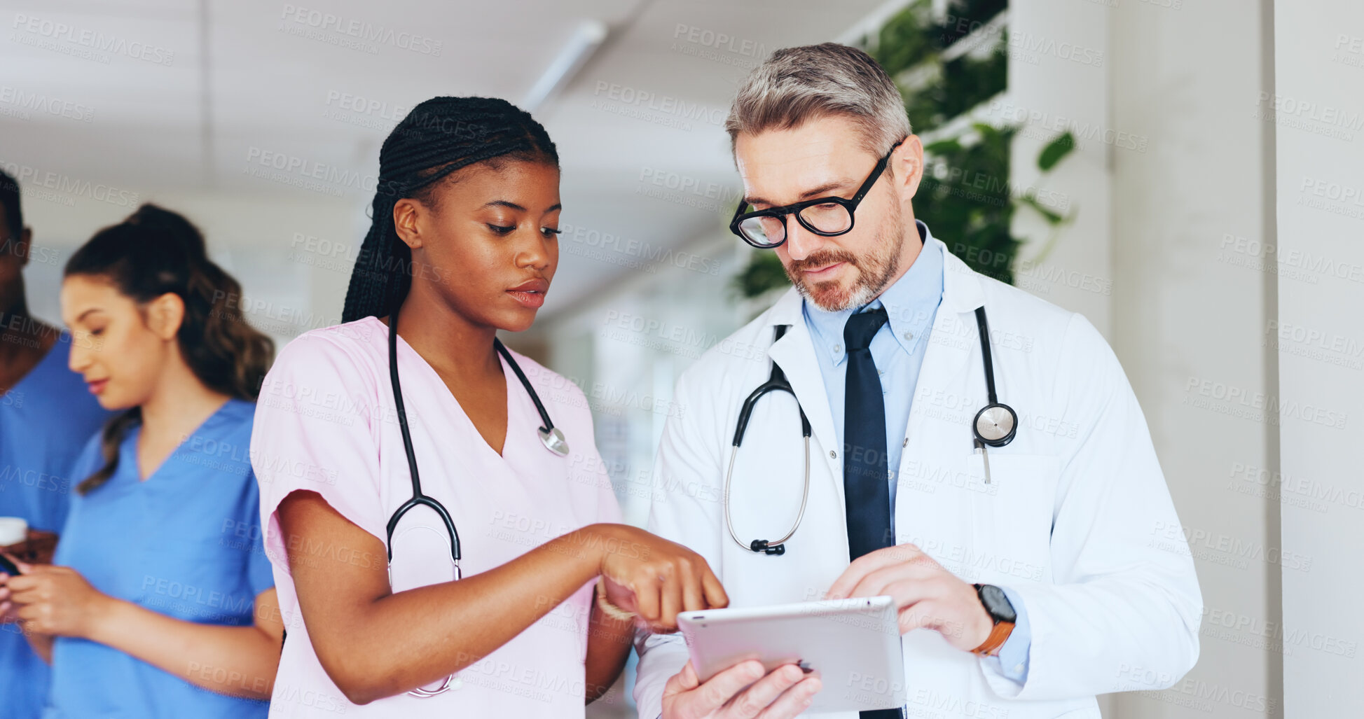 Buy stock photo Hospital, meeting and doctor on tablet with nurse for online report, patient results and treatment plan. Healthcare, team and man and woman on tech for medical research, surgery schedule and advice