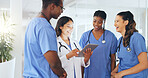 Hospital, talking and doctor with nurses on tablet for medical report, patient results and treatment plan. Healthcare, team and man and women on tech for feedback, surgery schedule and insurance 