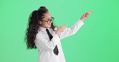 Buy stock photo Advertising, green screen and pointing with girl child in studio for announcement, news or notification. Gesture, glasses and marketing with female kid isolated on mockup space for update message