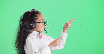 Buy stock photo Girl, consultant and pointing with headset in studio for call center cosplay on a green background. Child, kid agent or junior consultant with online advertising for role play or pretend on space