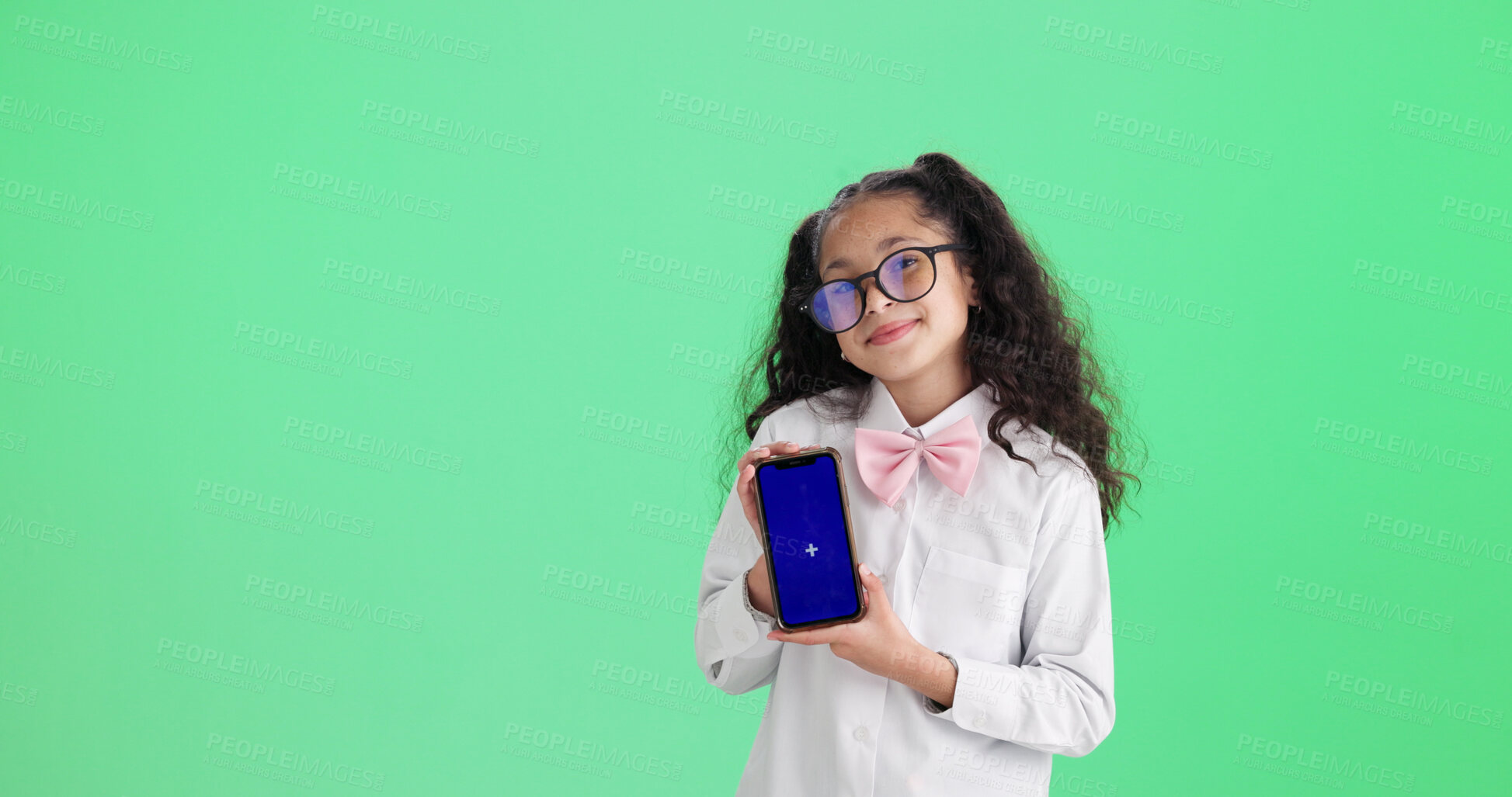 Buy stock photo Green screen, mobile and girl with smile for portrait, app promotion or advertising for digital education. Mockup space, student or child with phone in studio, elearning site or platform announcement