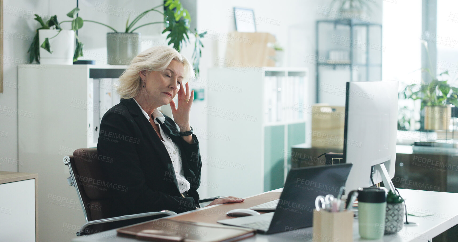 Buy stock photo Woman, financial advisor and headache with pain at office for stress, tired or job at investment company. Mature person, broker and exhausted with laptop, migraine or frustrated for burnout at agency