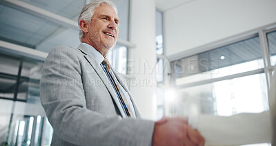 Buy stock photo Business, mature man and handshake in office for welcome, introduction and partnership. Low angle, people and shaking hands for greeting, employee agreement and thank you for onboarding opportunity