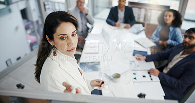 Buy stock photo Woman, writing and presentation with board, meeting and brainstorming for financial growth in office. Boardroom, investment banker and risk analysis for project with people, collaboration and above