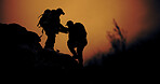 Helping, hiking and silhouette of people outdoor for adventure, support or vacation. Trekking, backpacking and assistance with friends for travel together, sunset and teamwork to climb mountain