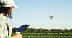 Agriculture, farm and woman with drone for field mapping, monitor crops and space in nature. Outdoor, person and farmer with flying tech for irrigation management, agro and growth surveillance
