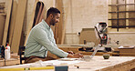 Carpenter, laptop or man in workshop, typing or online reading for manufacturing checklist. Person, furniture industry or entrepreneur in factory, pc or email for timber inventory and project invoice
