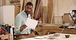 Carpentry, man and phone call in workshop with paperwork, talk and order timber for woodwork company. Manufacturing, business and person with tech, supplier contact and discussion for lumber stock.