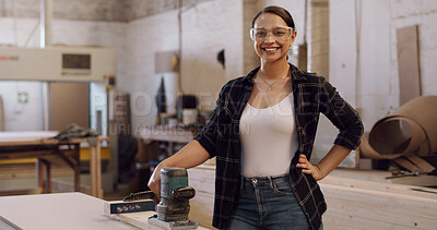 Buy stock photo Portrait, woman and sanding machine in workshop with woodwork, glasses or furniture manufacturing. Confident, person and smile in factory with electric tools, carpentry gear and timber for production