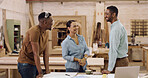 Carpentry, laughing and talking with team in factory for manufacturing or production process. Funny, planning and woodworking with happy carpenter people in lumber warehouse for discussion or meeting