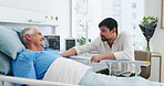 Elderly father, son and communication in hospital for visit, emotional support and check up for healing. Care, comfort and senior patient with man for health recovery, chat or smile in medical center