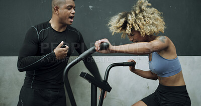 Buy stock photo Personal trainer, stopwatch or woman with stationary bike in gym, instructions or cycling training for fitness. Endurance, equipment or instructor with timer for exercise routine, active or coaching