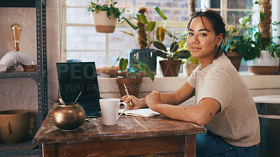 Buy stock photo Planning, portrait and writing with woman in pottery boutique for management of small business. Notebook, schedule and startup with store owner in ceramics gallery for decoration or retail sale