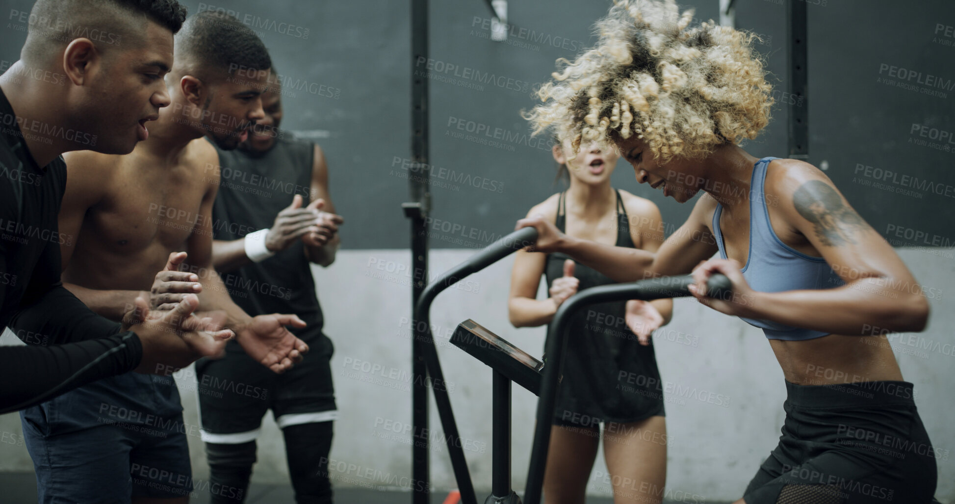 Buy stock photo Applause, crowd and woman with stationary bike in gym, workout and cycling training for fitness motivation. Endurance practice, equipment and people clapping for exercise support, active and wellness