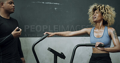 Buy stock photo Personal trainer, stopwatch or tired woman with stationary bike in gym, fatigue or cycling training for fitness. Break, equipment or instructor with timer for exercise routine, exhausted or coaching