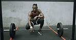 Fitness, serious and black man with barbell in gym, workout break or strength training with space. Bodybuilder, shirtless person and portrait with weights for power, muscle or rest with determination