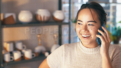 Buy stock photo Phone call, smile and Asian woman in store with pottery, client chat or negotiation with clay supplier. Happy, networking or owner with tech, discussion or vendor coordination in ceramic business.