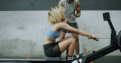 Buy stock photo Woman, exercise and personal trainer in gym with rowing machine, endurance and strength training. Space, people and coach in health club with ergometer, stopwatch and HIIT workout for fitness goals.