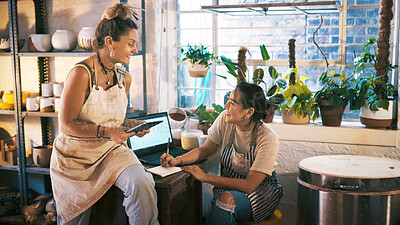 Buy stock photo Women, tech and pottery shop with meeting for online order, customer service or sale. Creative people, employees or conversation with smile and notebook for small business, ceramic startup or support