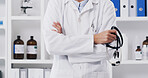 Doctor, hands and arms crossed with stethoscope for cardiology trail, confidence and tool in hospital. Person, clinic and medical worker with pride for heartbeat, consolation and checkup or monitor