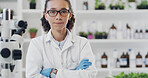 Woman, crossed arms and portrait of scientist in laboratory with confidence for science career. Serious, glasses and female chemist with pride for pharmaceutical innovation with medical development.