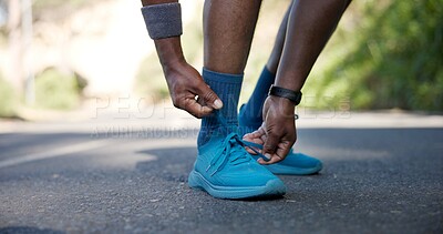 Buy stock photo Outdoor, hands and tying sneaker lace for fitness, getting ready and safety measure for training. Start workout, man or runner tie shoes for exercise preparation, body development or wellness on road