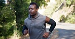 Fitness, mountain road and running with black man outdoor for cardio challenge or physical improvement. Exercise, health and training with African runner in nature for wellness or workout routine