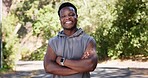 Portrait, fitness and black man in street, arms crossed and happiness with exercise. Outdoor, runner and African person with nature, wellness and commitment to training routine and health benefits