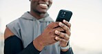 Man, hands and fitness with phone for social media, sport app or outdoor workout routine. Active, male person or runner typing with smile on mobile smartphone for exercise, health tips or guide