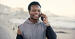 Black man, phone call and smile with fitness on beach promenade with conversation on break. African person, runner and space with smartphone, discussion and happy for exercise on ocean boardwalk