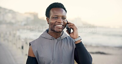 Buy stock photo Black man, phone call and smile with fitness on beach promenade with conversation on break. African person, runner and space with smartphone, discussion and happy for exercise on ocean boardwalk