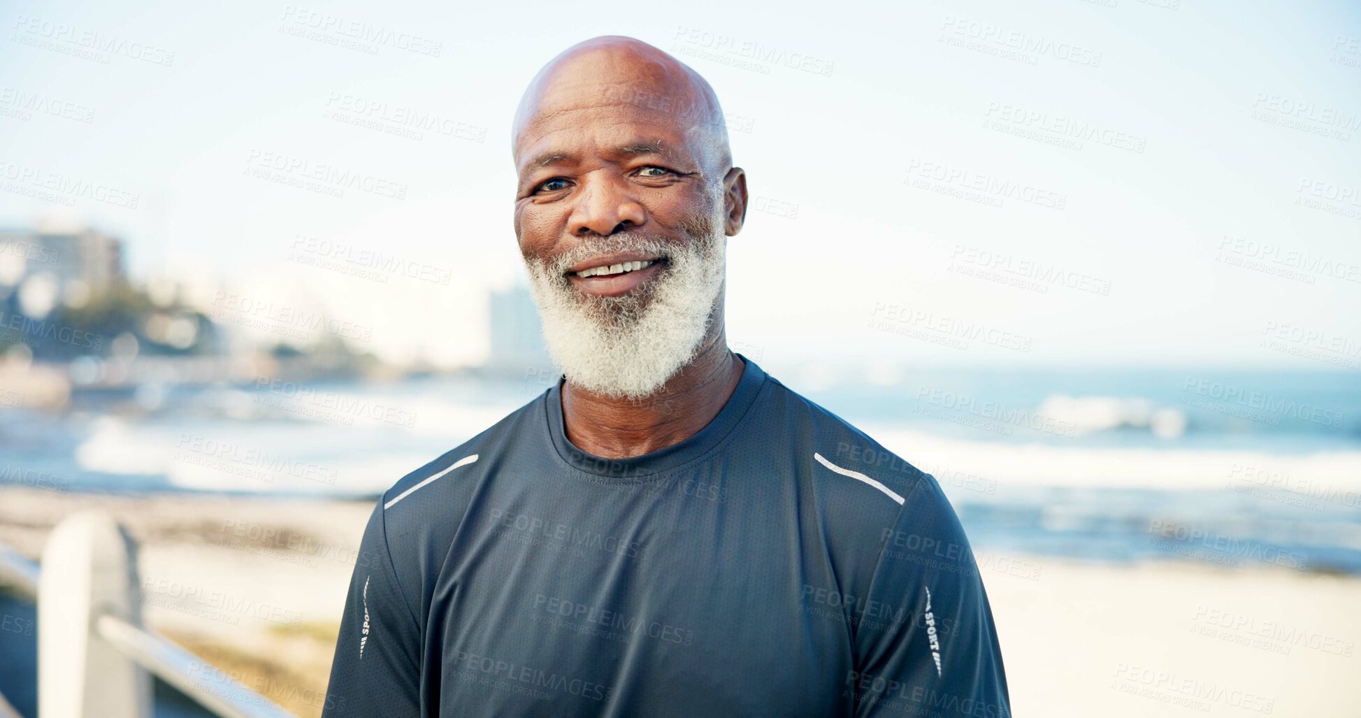 Buy stock photo Portrait, senior black man and fitness at beach for exercise, training and fresh air for wellness. Smile, elderly person and ocean for endurance, workout and physical activity for retirement hobby