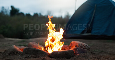 Buy stock photo Night, tent and wood with flames for bonfire, smoke and embers burning for camping travel holiday. Evening light, heat source and glowing log with sparks in nature, rocks and outdoor for weekend trip