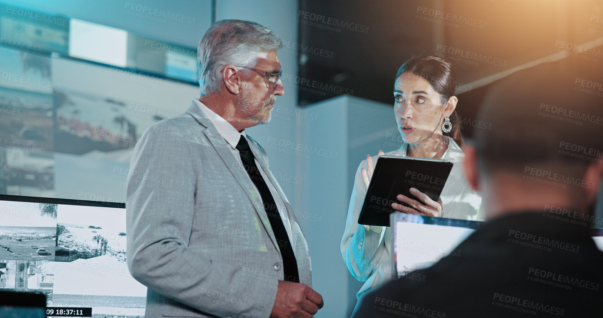 Buy stock photo People, private investigator or discussion with tablet in control room for security surveillance. Mature man, woman or inspector team with tech or cctv footage for safety or protocol in workplace